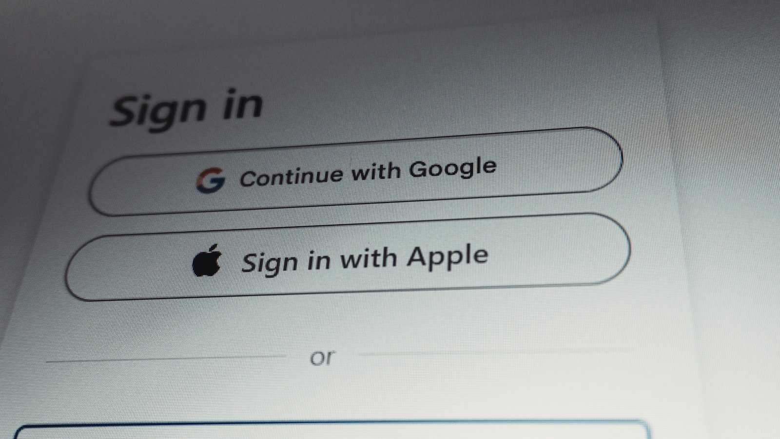 A sign-in screen showing options to continue with Google or Apple
