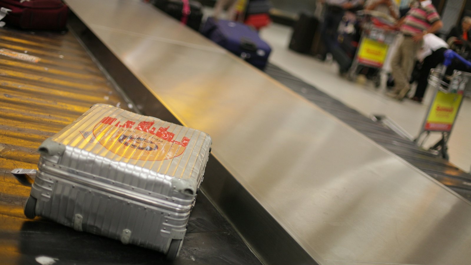 A suitcase on an airport baggage belt