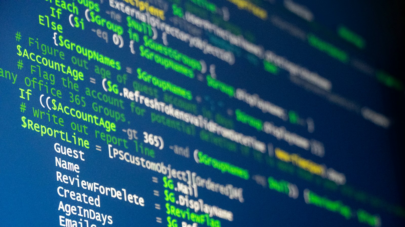 Lines of computer code on a screen in blue and green