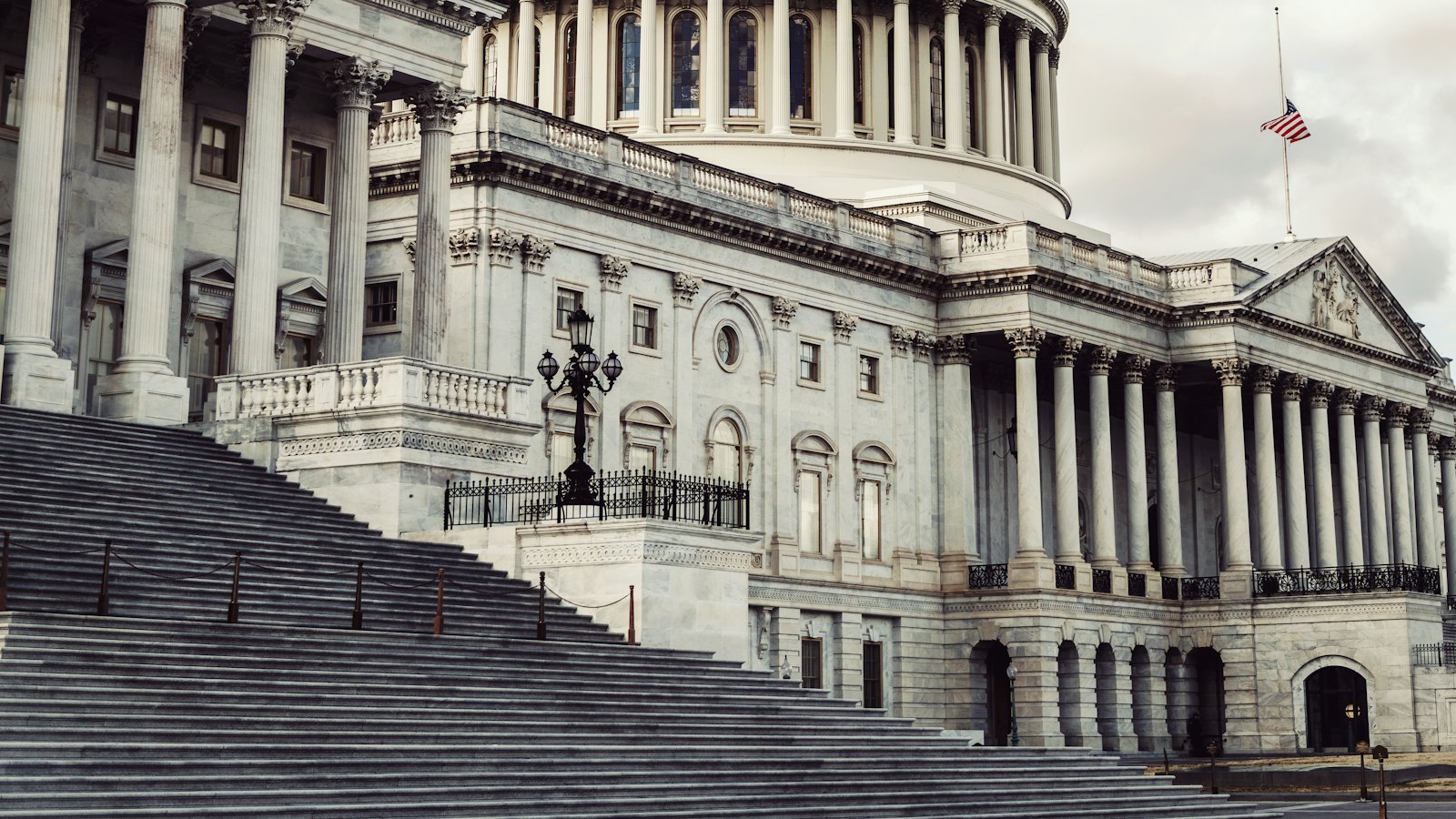 A grand stone government building with wide steps