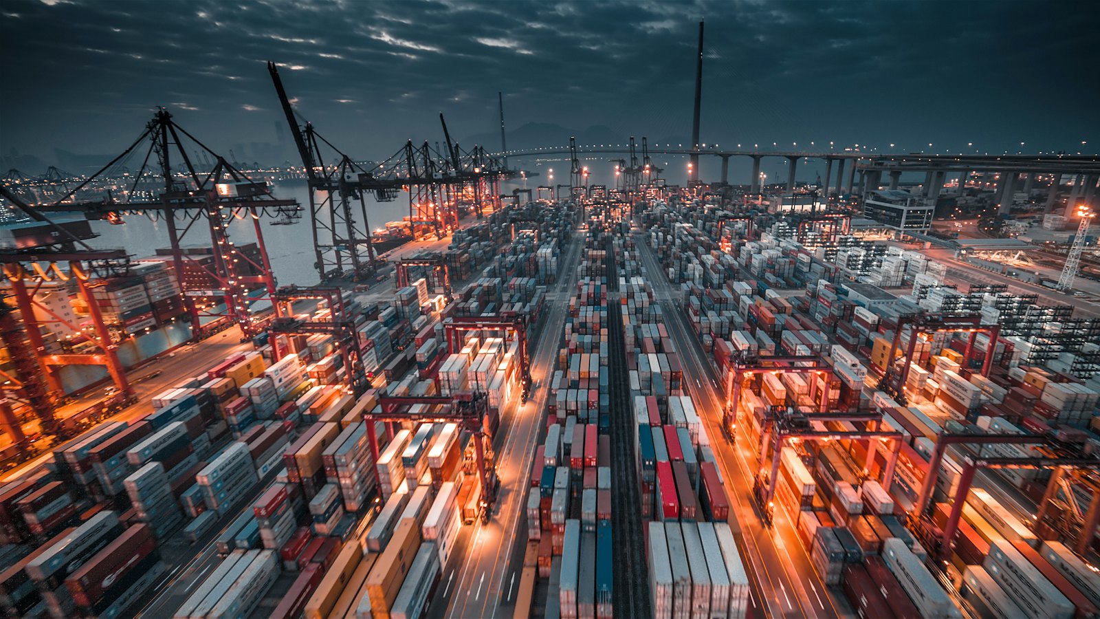 A busy container port at dusk