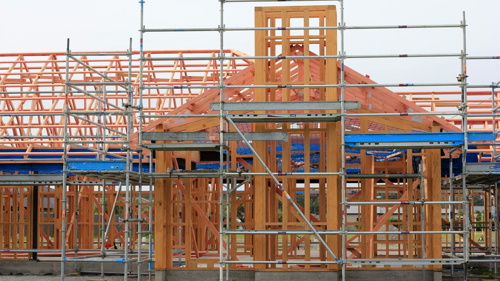 A house under construction with scaffolding