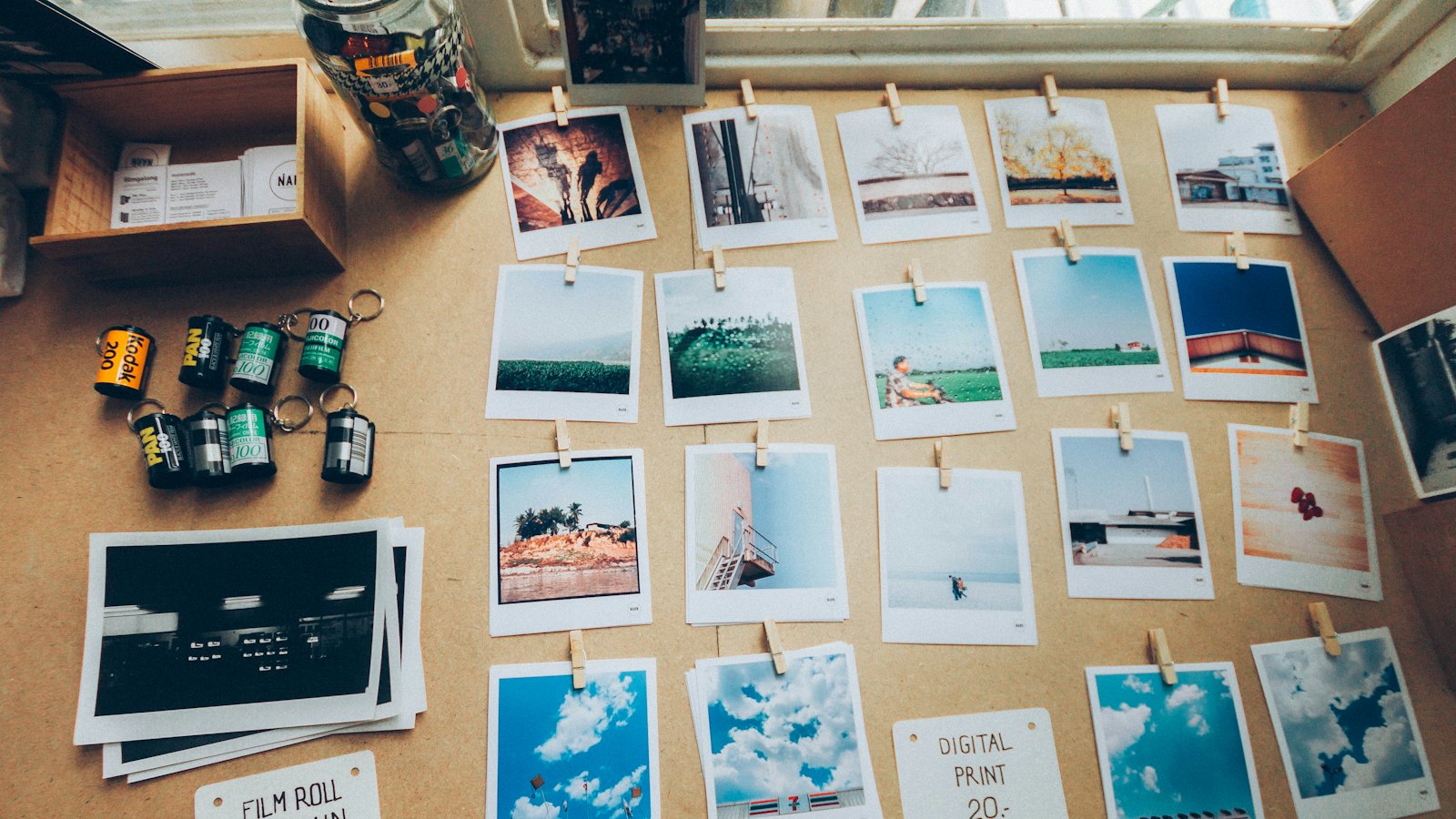 Printed photos pinned to a cork board