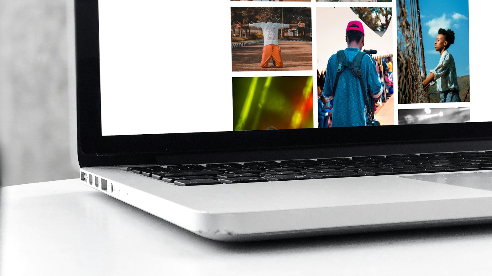 An open laptop showing a web page with photos