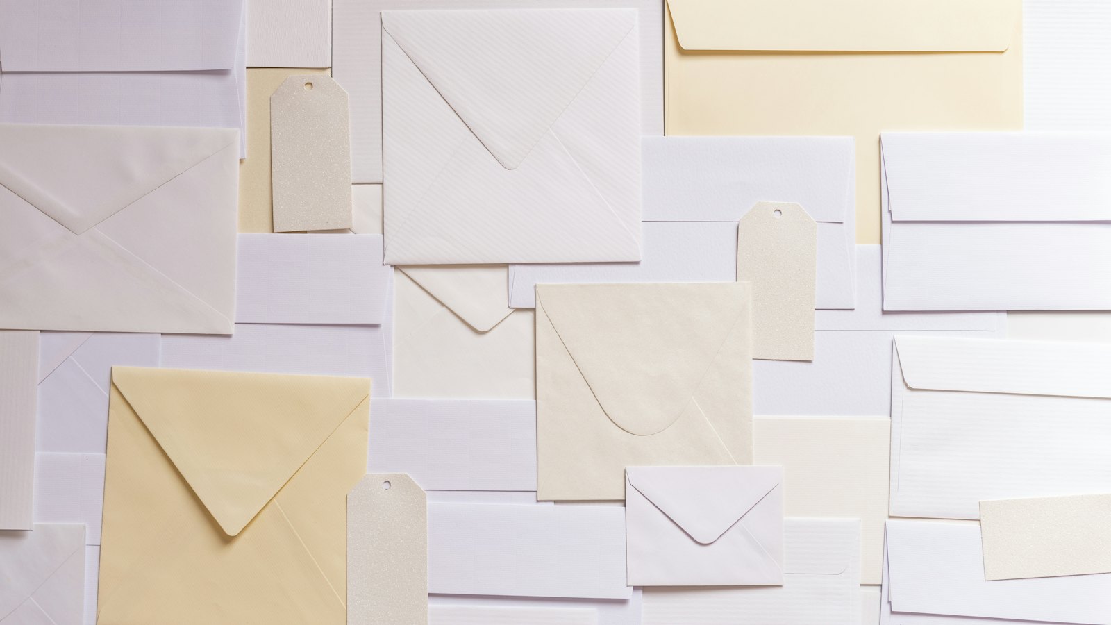 Envelopes of different sizes spread across a surface