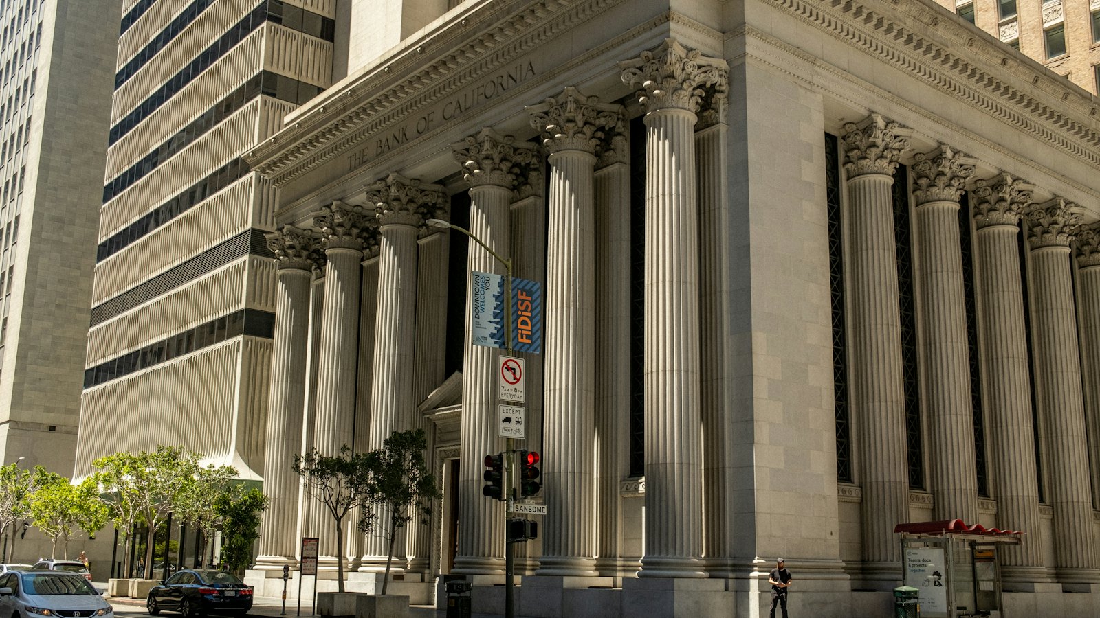A bank building with stone columns