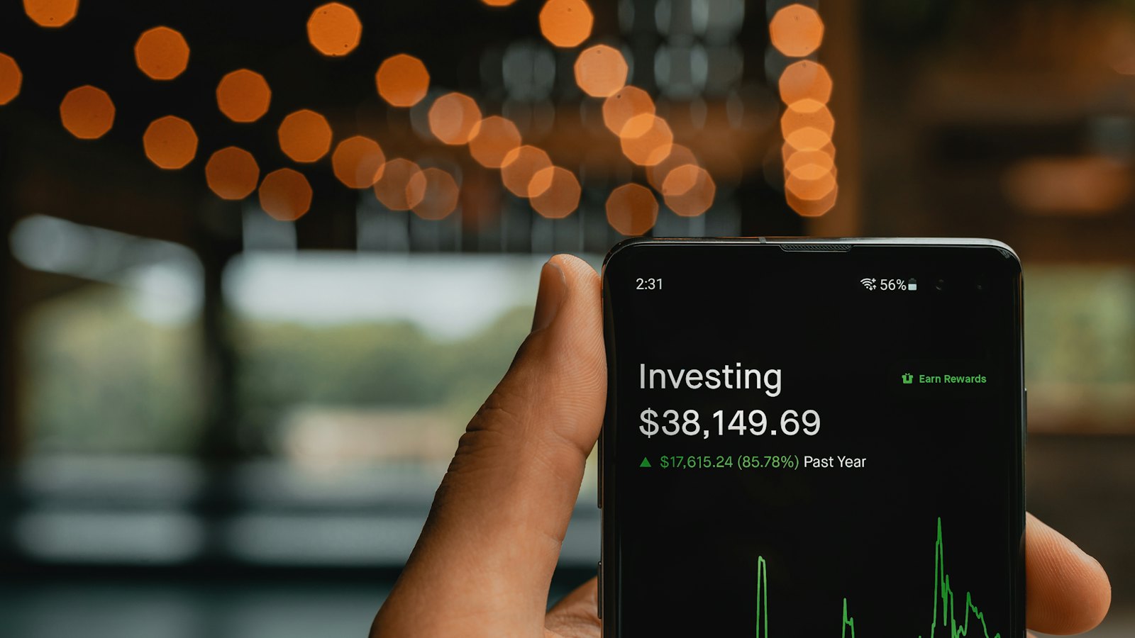 A phone showing an investment balance