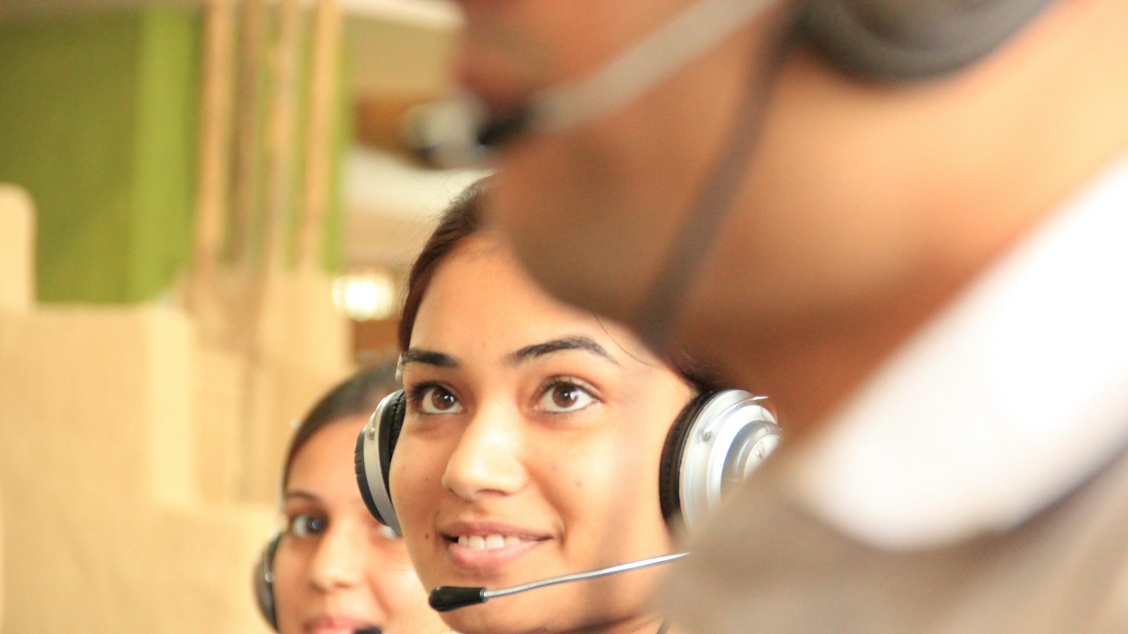Call centre staff wearing headsets