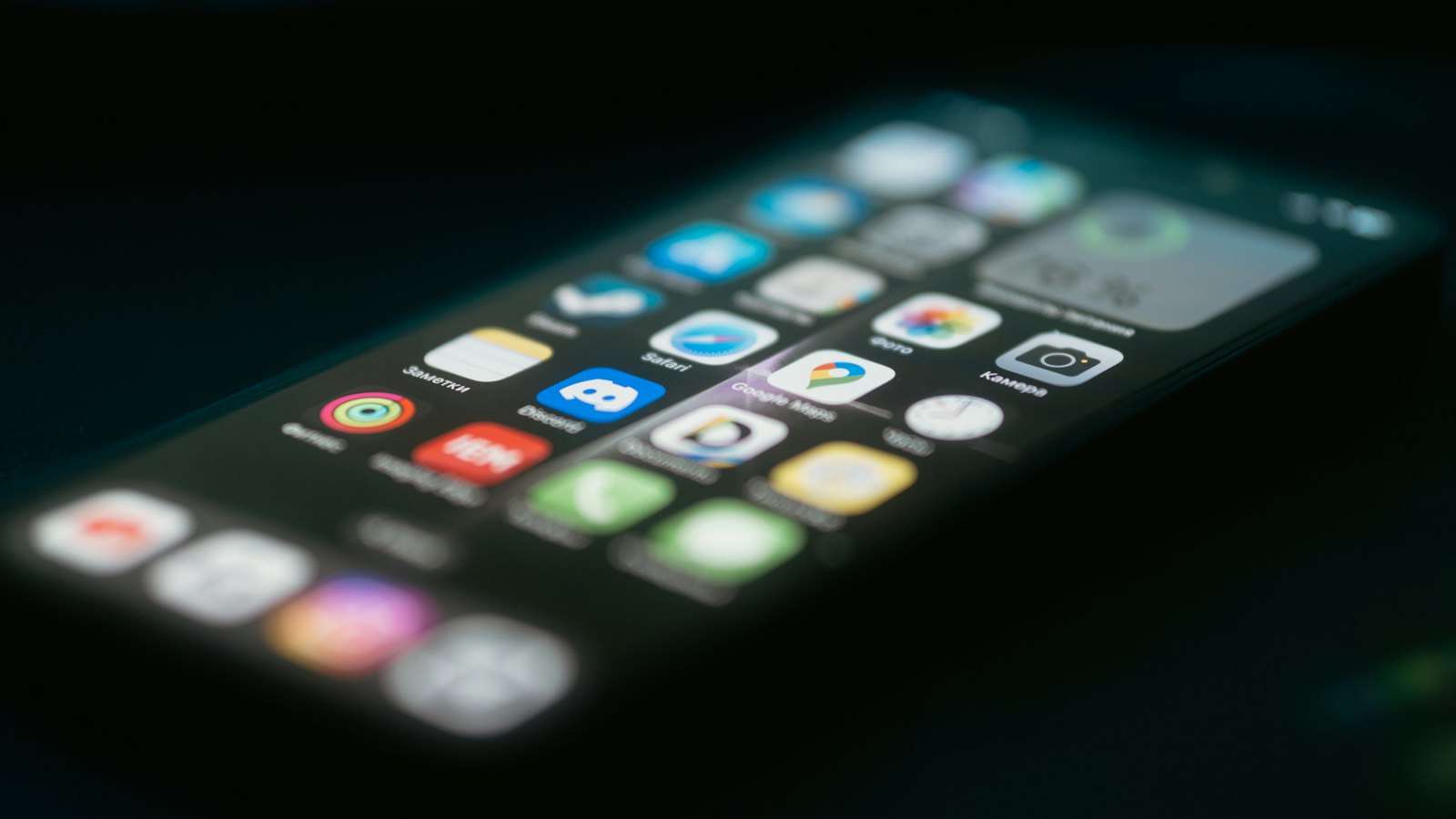 A blurred phone screen of app icons