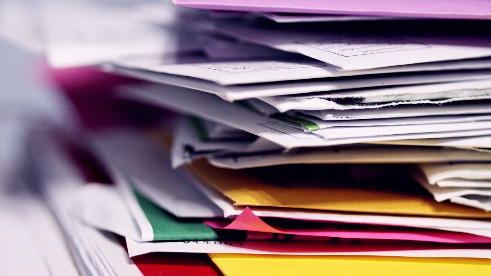 A stack of papers and envelopes