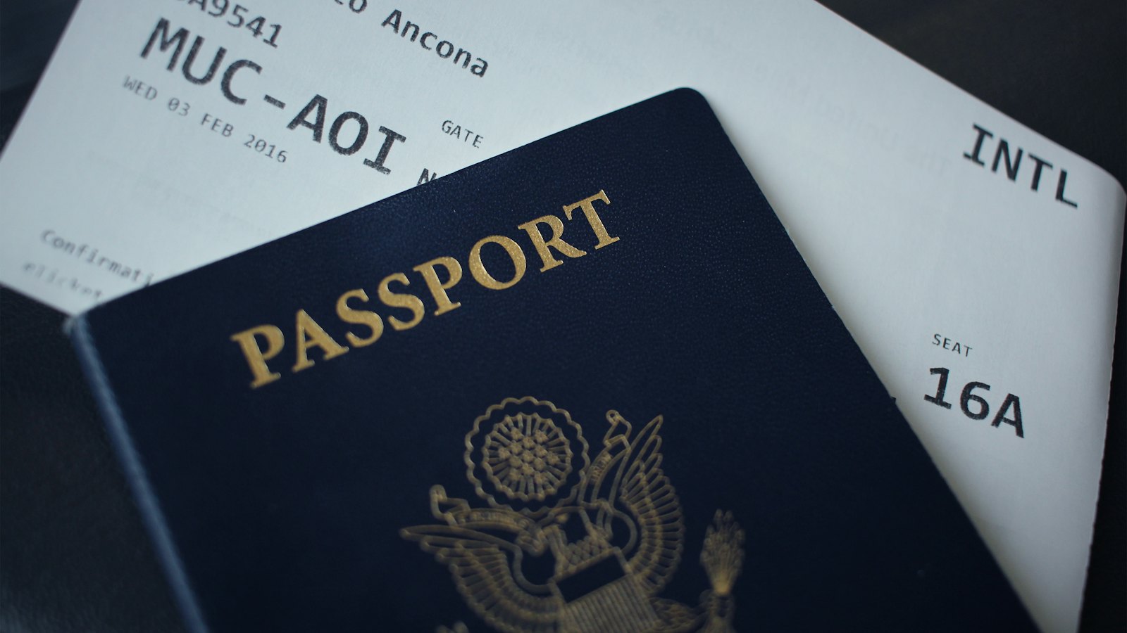 A passport with a boarding pass