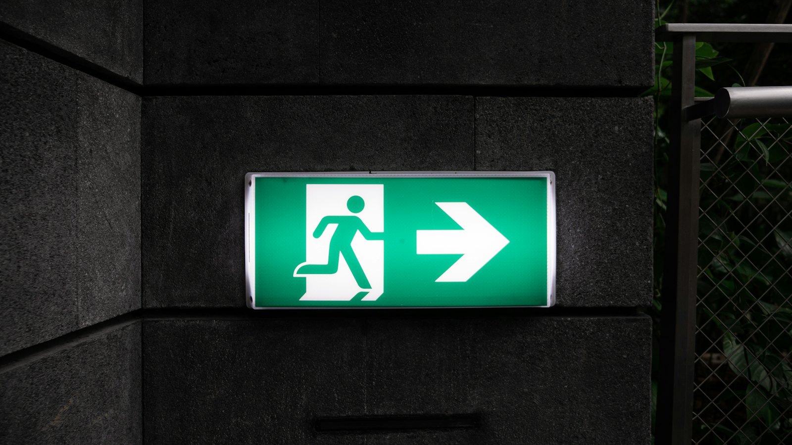 An exit sign with an arrow