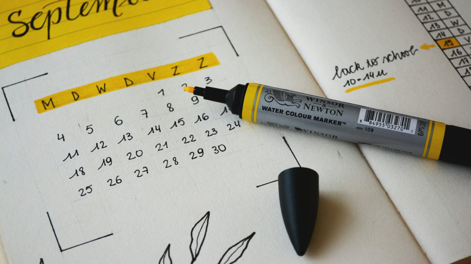 A marker on a monthly planner page
