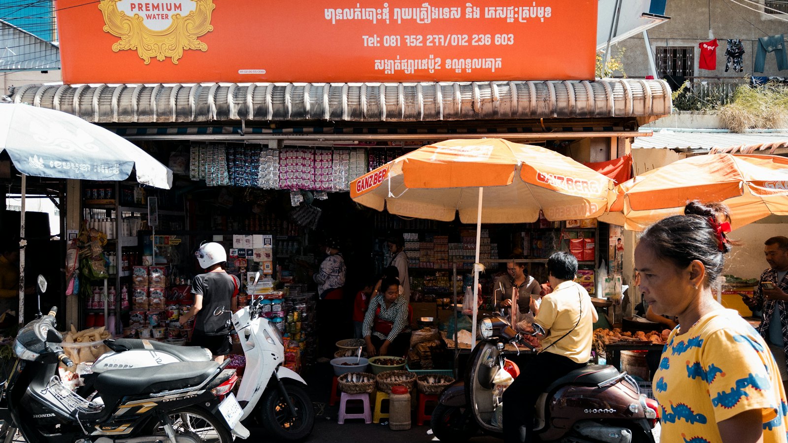 A busy street market with small shops