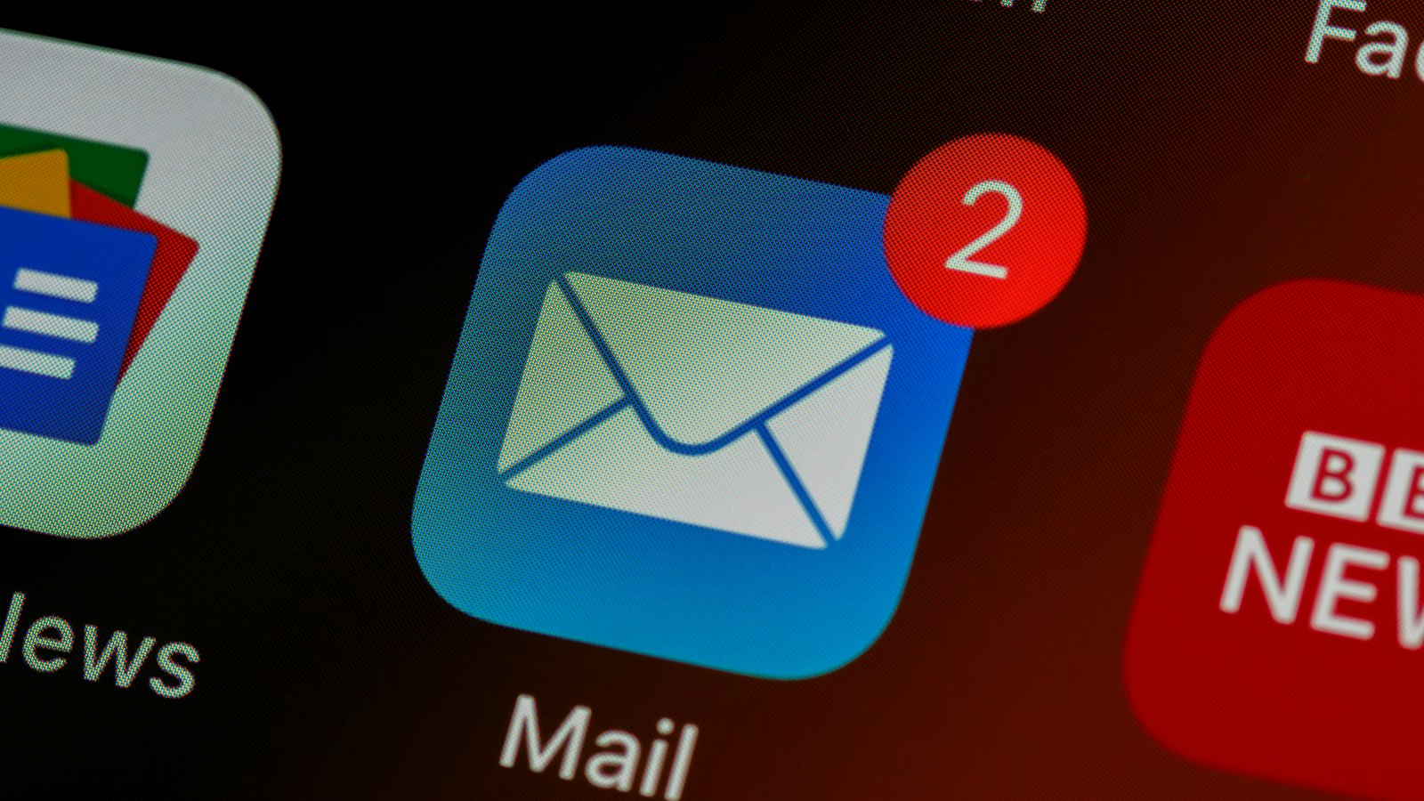 A phone screen showing a mail app icon with two notifications
