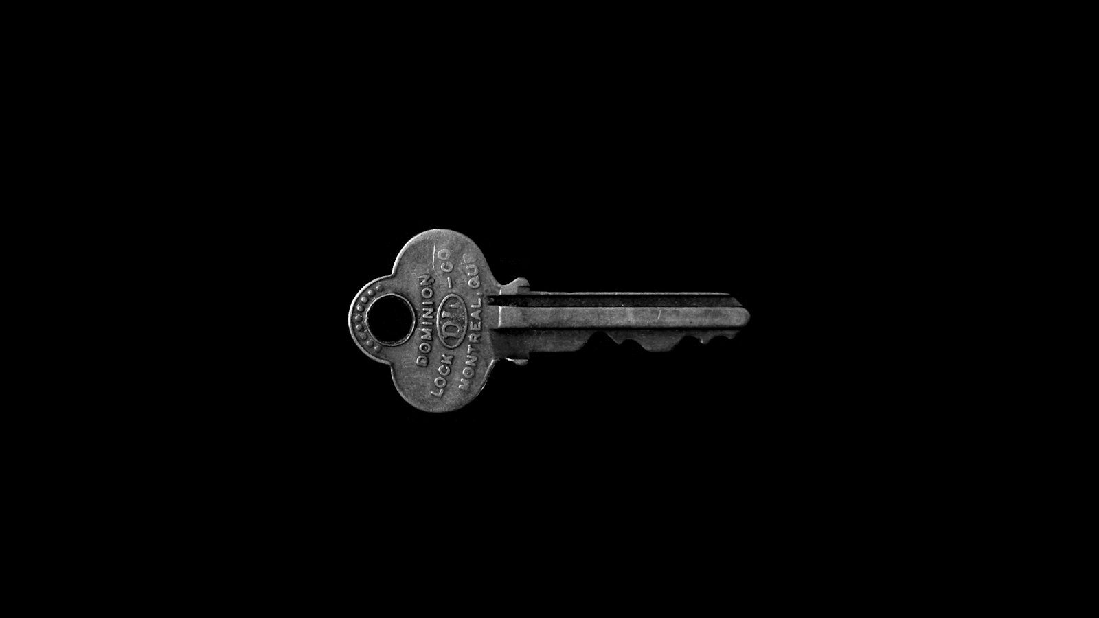 A single key on a black background