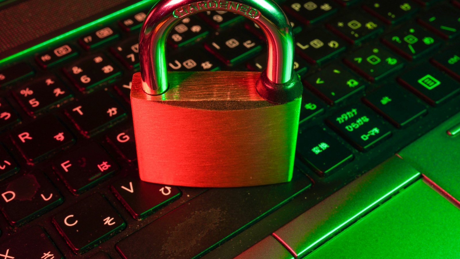 A red padlock on a keyboard lit in red and green