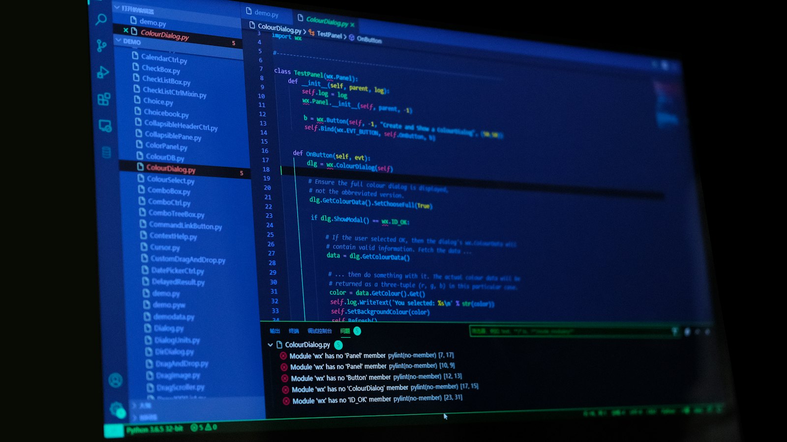 A screen showing code in a dark room