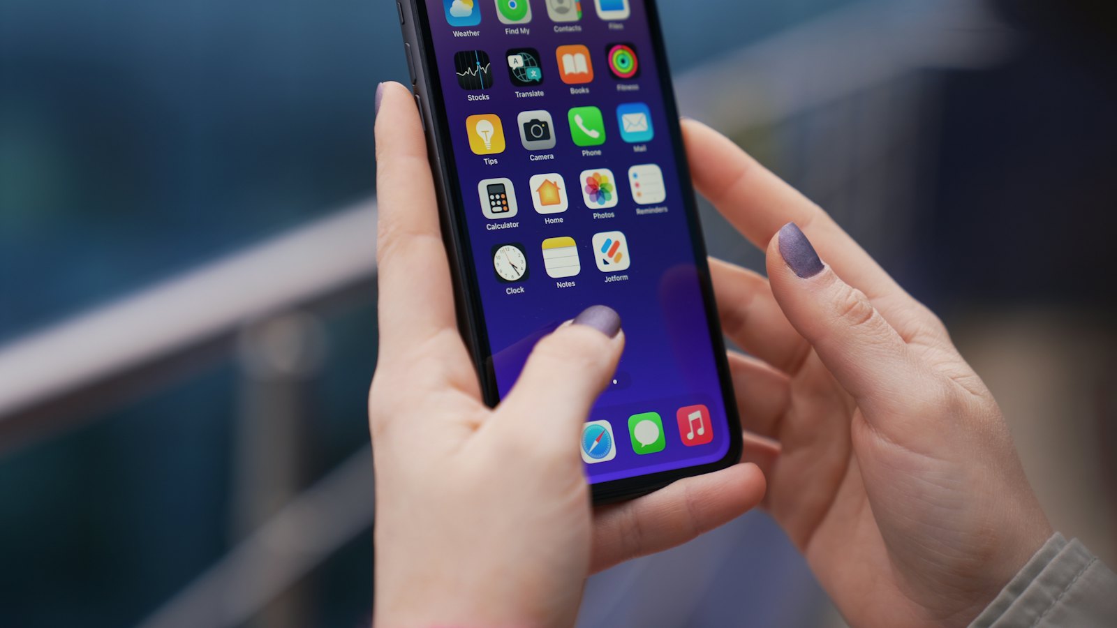 A person holding a smartphone with both hands