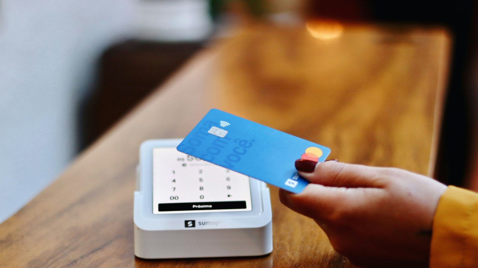 A card being tapped on a shop card reader
