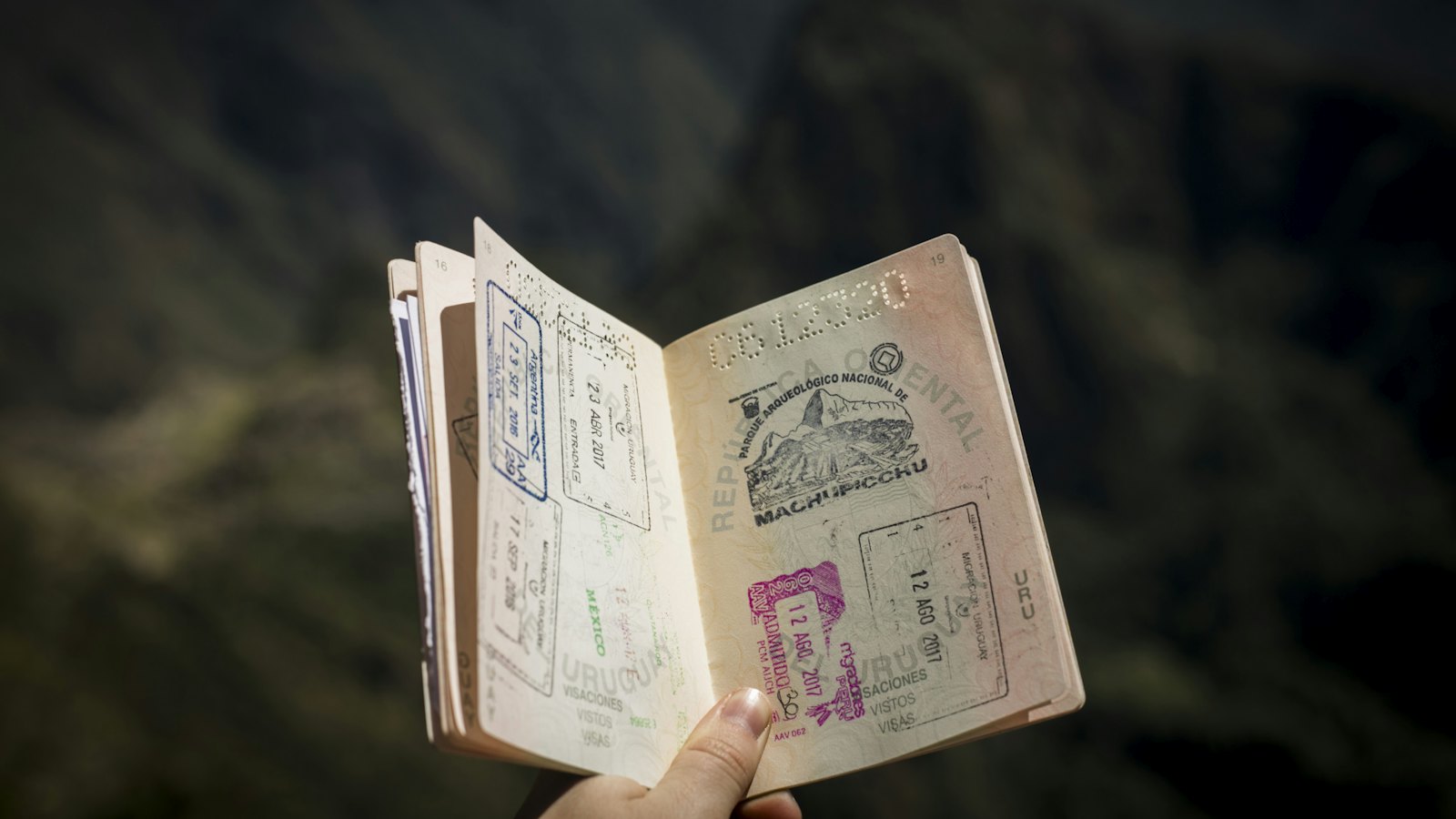 An open passport with visa stamps