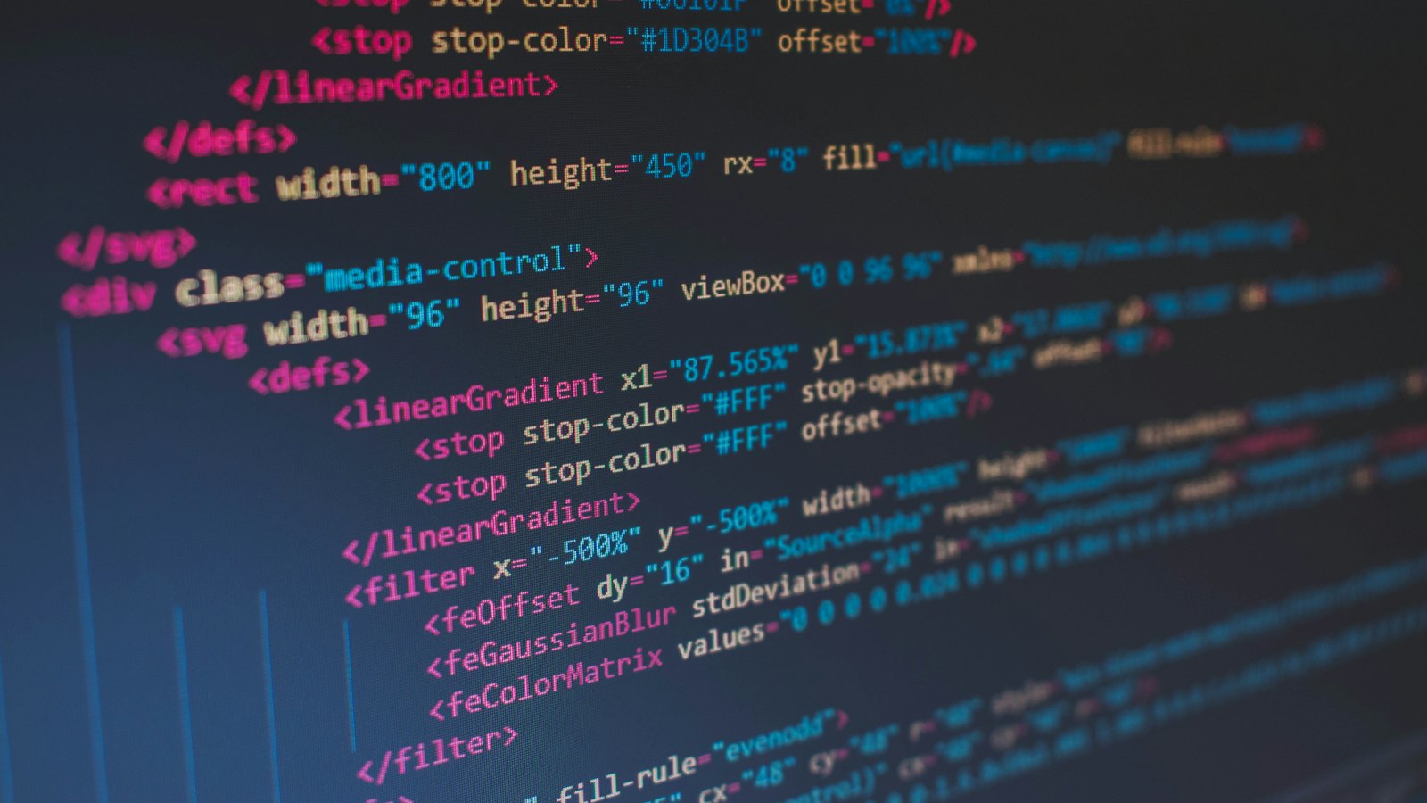 Lines of website code on a dark screen