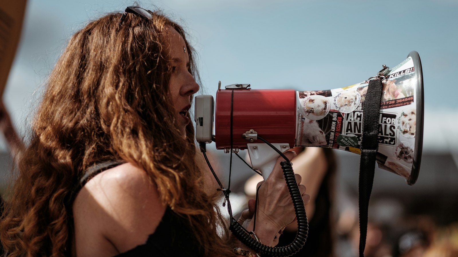 A woman speaking through a megaphone
