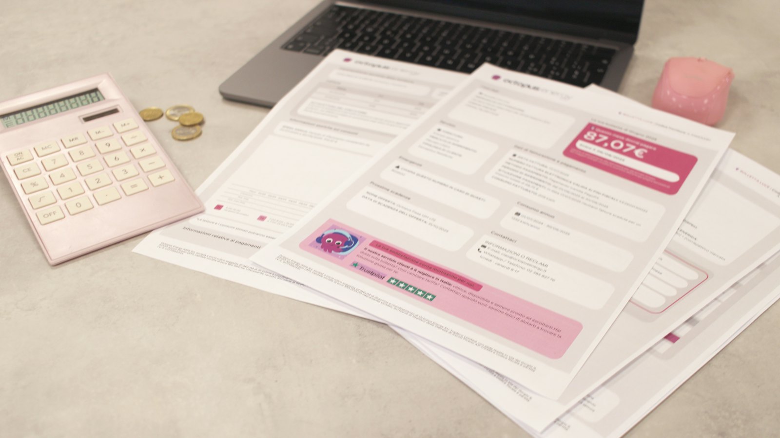 Bills and a calculator on a desk