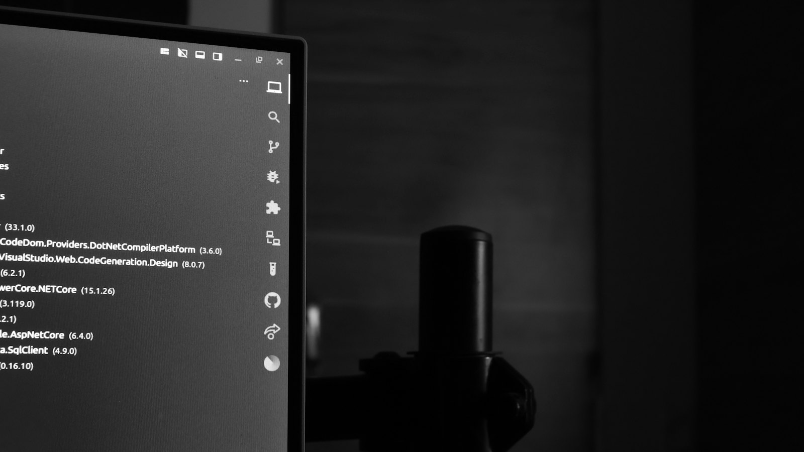 A computer monitor glowing in a dark room