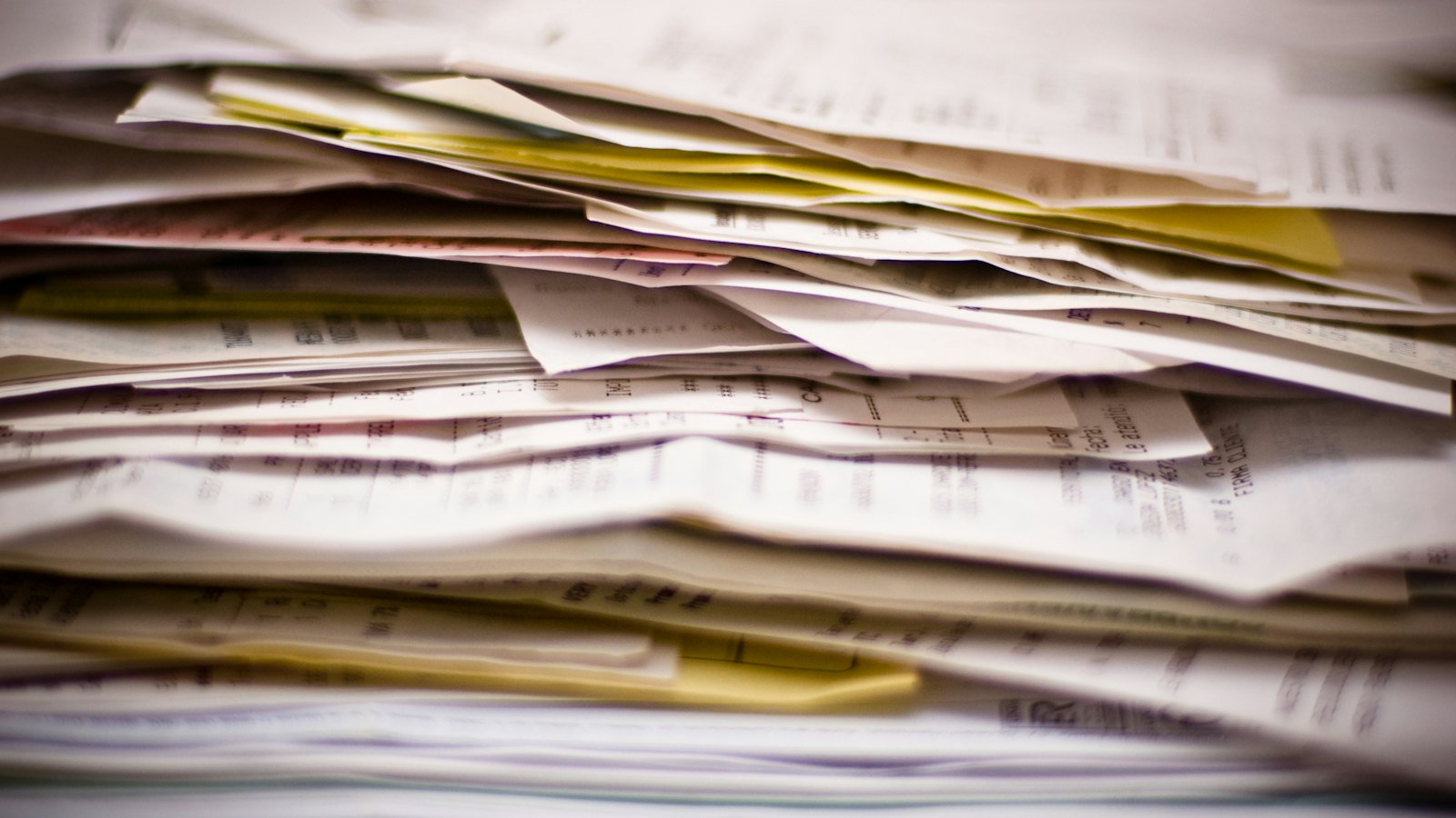 A thick stack of invoices and paperwork