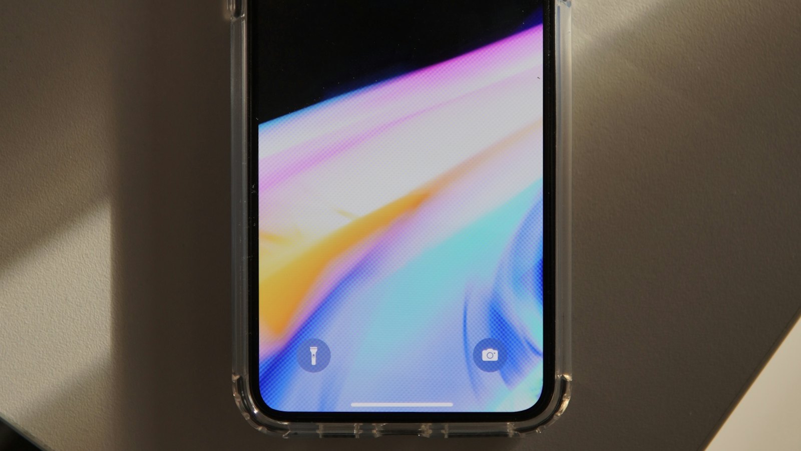 A smartphone lock screen showing the time