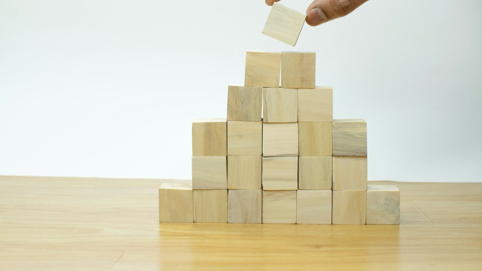 Wooden blocks stacked into a pyramid