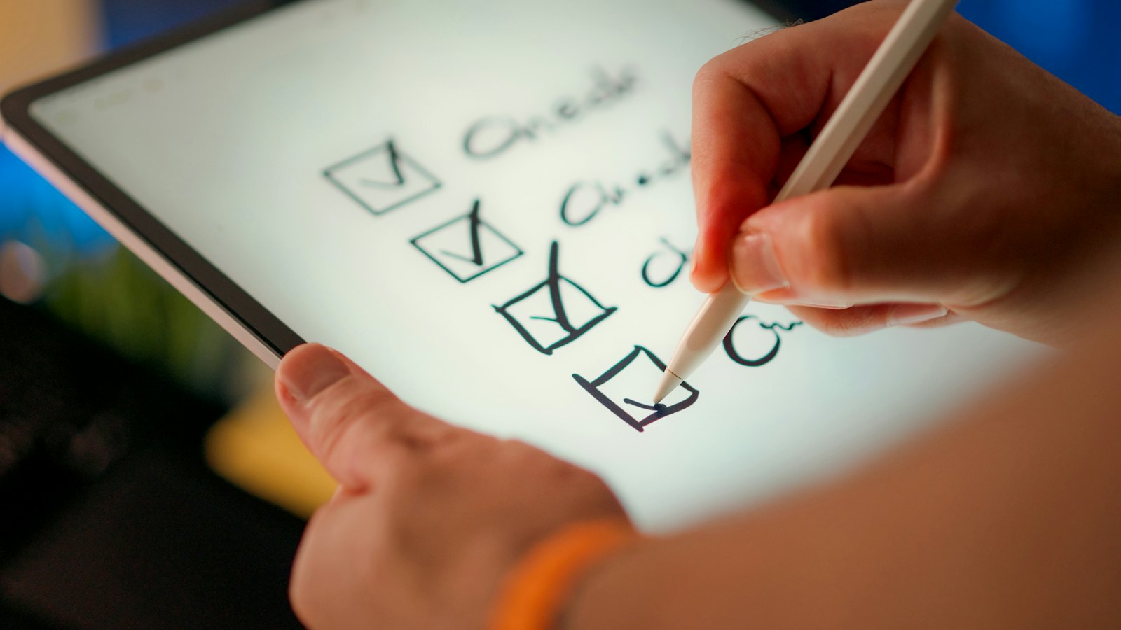 Ticking items off a checklist on a tablet