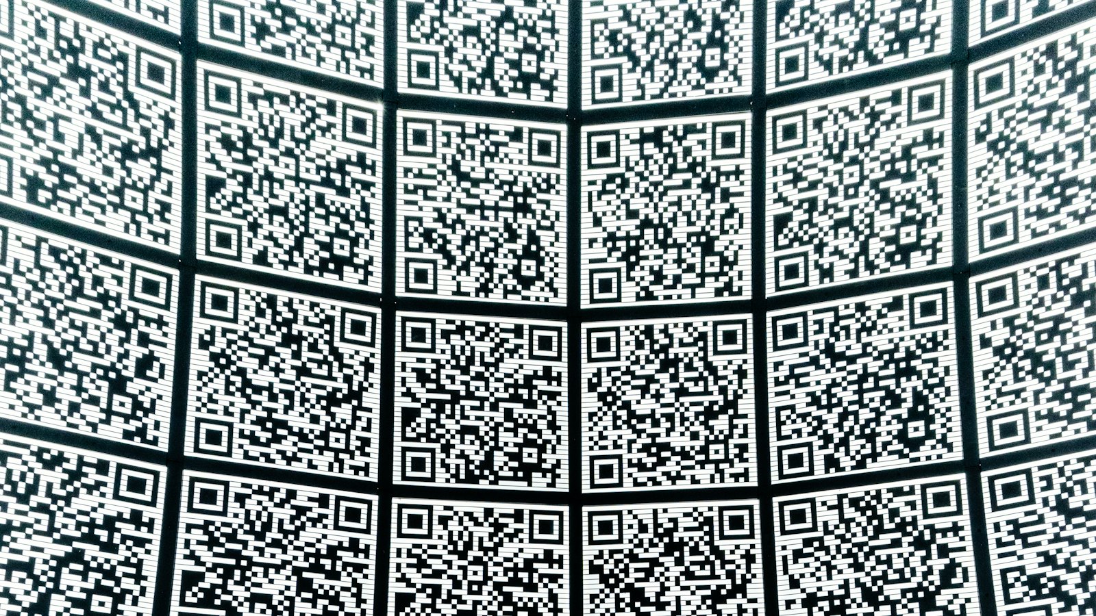 A wall covered in QR codes